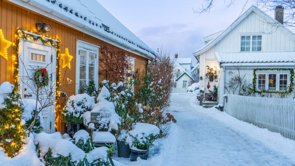 Street with wooden houses and winter Christmas lights